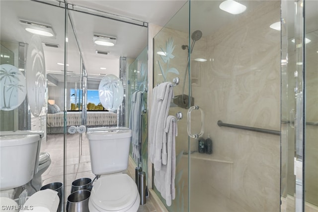 bathroom with tile walls, toilet, a shower with shower door, and tile flooring