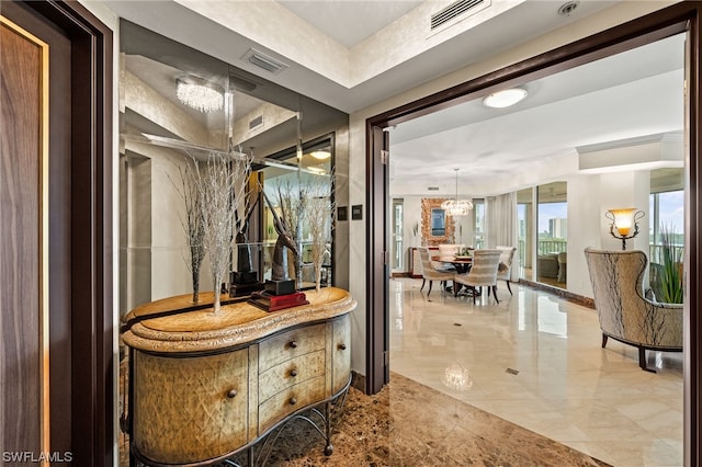 bathroom with a chandelier