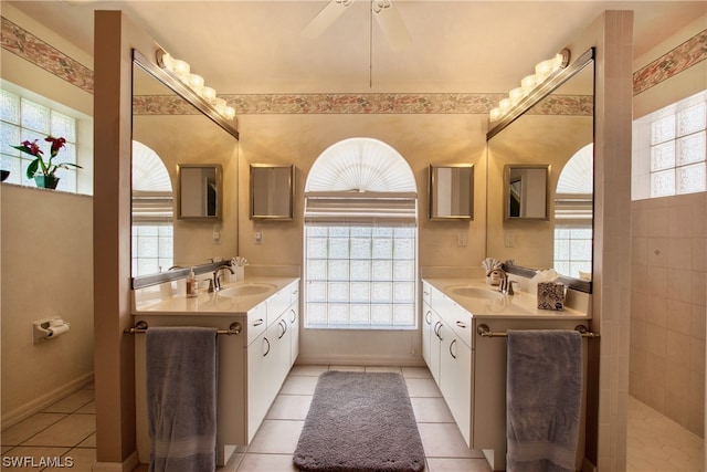 bathroom featuring dual sinks, ceiling fan, and large vanity