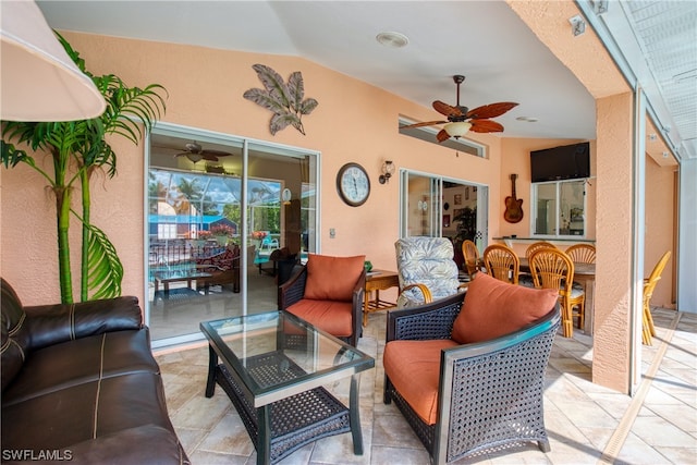 view of patio with an outdoor living space and ceiling fan