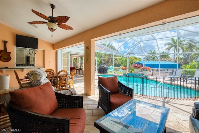 sunroom / solarium with ceiling fan and lofted ceiling