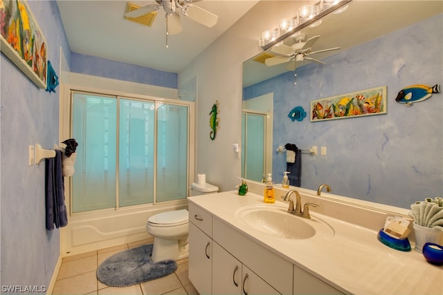 full bathroom with toilet, ceiling fan, enclosed tub / shower combo, vanity with extensive cabinet space, and tile flooring