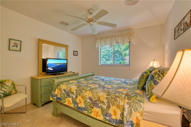 tiled bedroom with ceiling fan