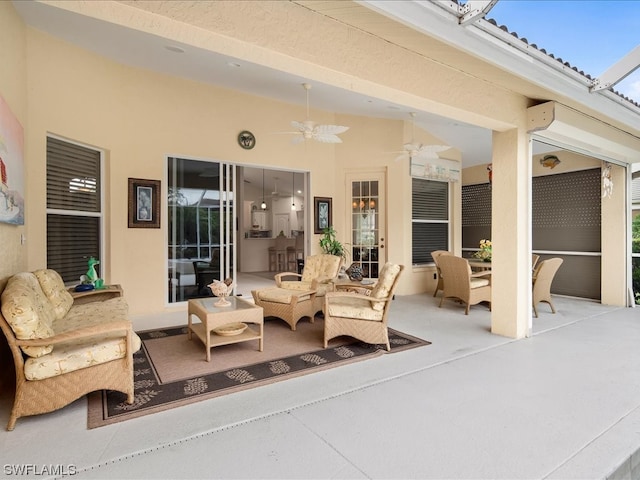 view of patio featuring an outdoor hangout area and ceiling fan