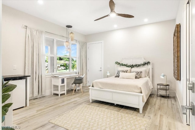 bedroom featuring recessed lighting, baseboards, wood finished floors, and a ceiling fan