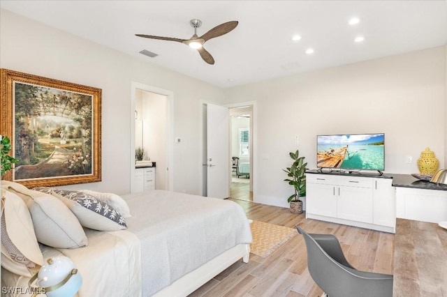 bedroom featuring visible vents, ensuite bath, light wood-style flooring, recessed lighting, and ceiling fan