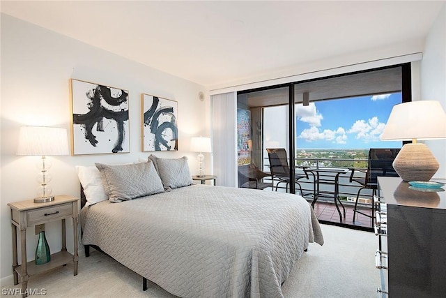 bedroom with access to outside, light colored carpet, and floor to ceiling windows