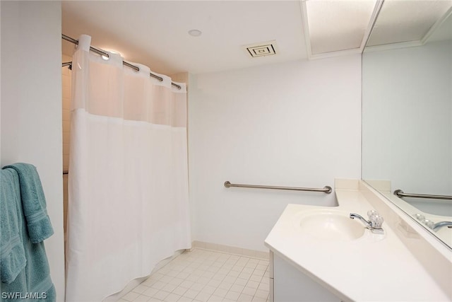 bathroom featuring vanity and tile patterned flooring