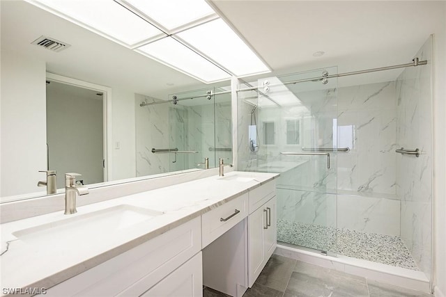 bathroom with walk in shower and vanity