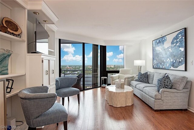 living room with hardwood / wood-style flooring and expansive windows