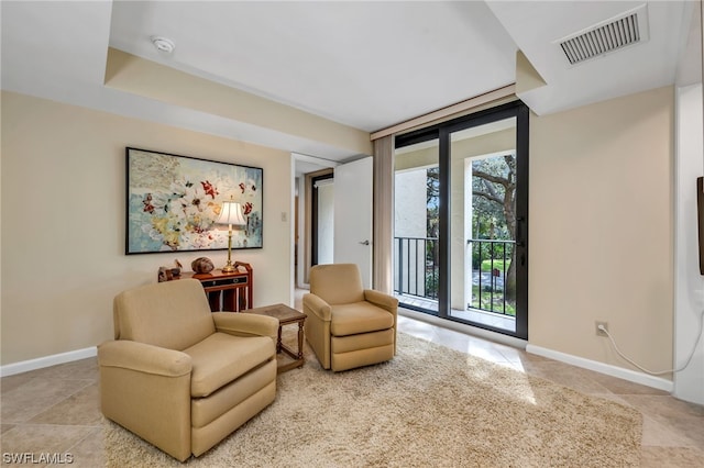 6040 Pelican Bay Blvd Unit D-105, Naples, FL 34108 - sitting room with light tile floors