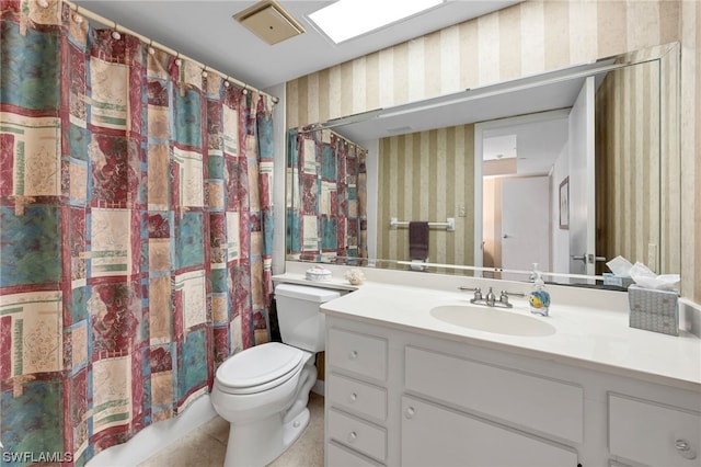 6040 Pelican Bay Blvd Unit D-105, Naples, FL 34108 - bathroom with toilet, vanity with extensive cabinet space, and tile flooring