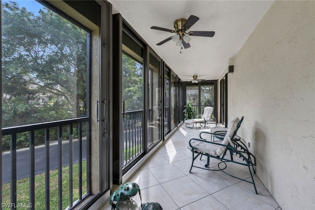 6040 Pelican Bay Blvd Unit D-105, Naples, FL 34108 - sunroom with plenty of natural light and ceiling fan