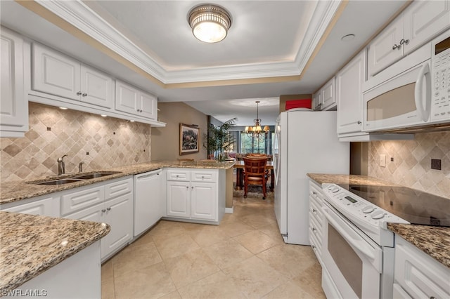 6040 Pelican Bay Blvd Unit D-105, Naples, FL 34108 - kitchen featuring white cabinetry, backsplash, white appliances, a notable chandelier, and ornamental molding