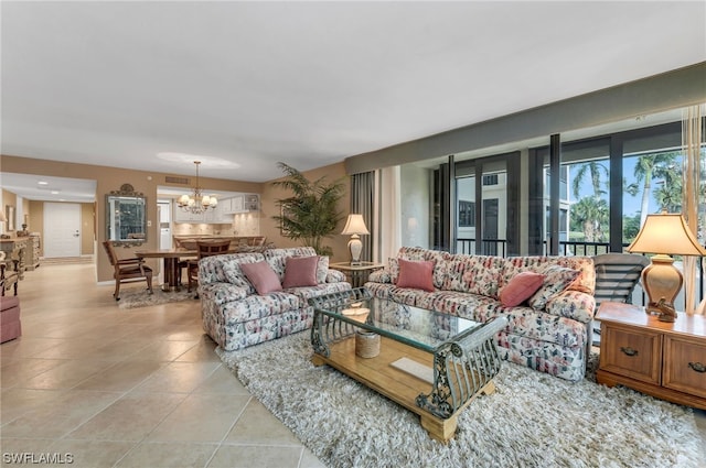 6040 Pelican Bay Blvd Unit D-105, Naples, FL 34108 - tiled living room featuring a notable chandelier