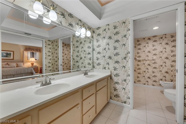 6040 Pelican Bay Blvd Unit D-105, Naples, FL 34108 - bathroom featuring toilet, double sink, vanity with extensive cabinet space, a bidet, and a tray ceiling