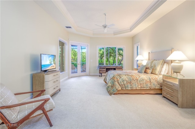 bedroom featuring a raised ceiling, access to exterior, ceiling fan, ornamental molding, and light carpet