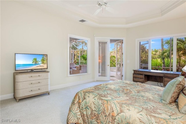 bedroom with access to exterior, carpet floors, a raised ceiling, visible vents, and ornamental molding