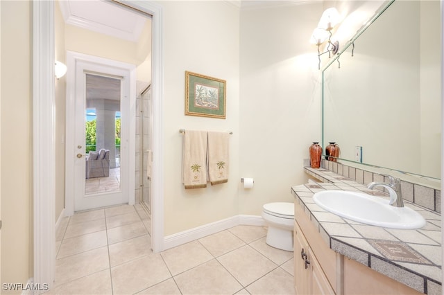 bathroom with a shower with shower door, vanity, crown molding, tile patterned flooring, and toilet