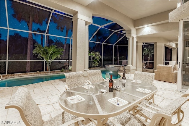 view of swimming pool featuring a lanai and a patio area