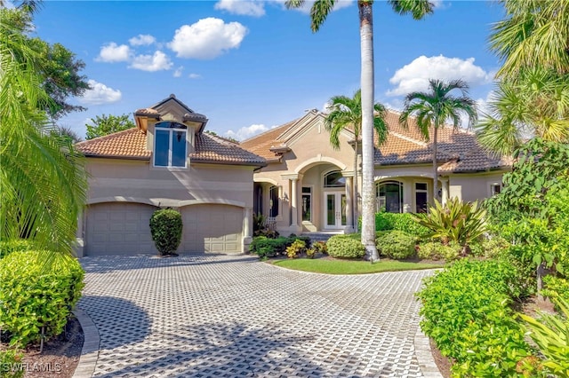 mediterranean / spanish-style home featuring a garage