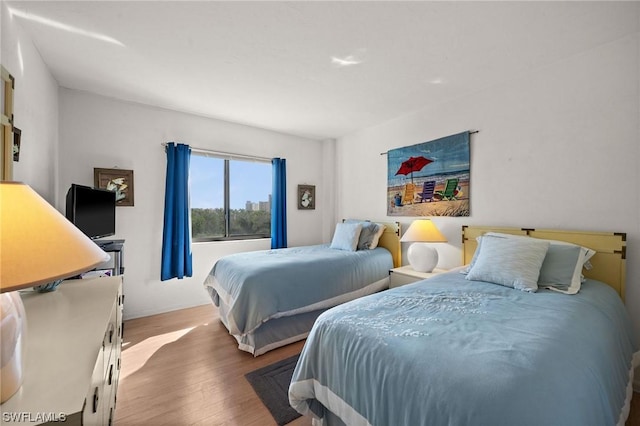 bedroom with wood finished floors