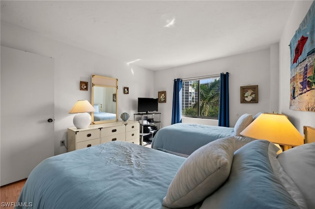 bedroom featuring hardwood / wood-style flooring