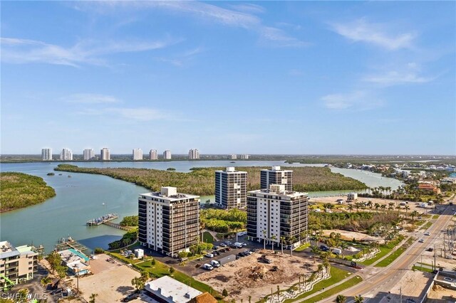 drone / aerial view featuring a water view and a city view