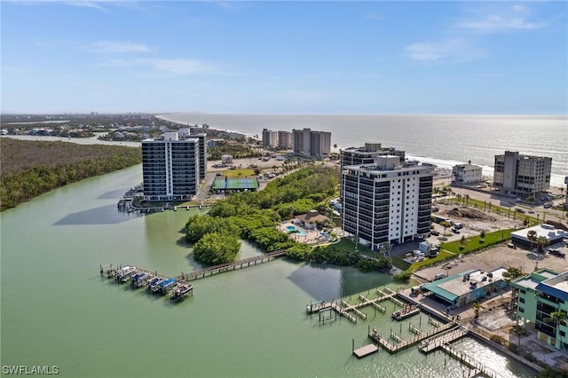 birds eye view of property featuring a water view and a view of city