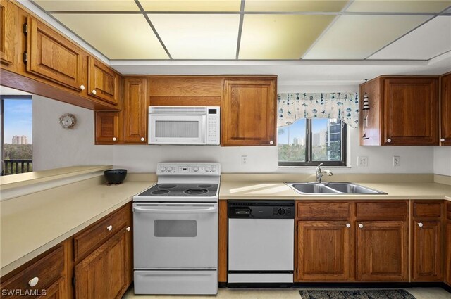 kitchen with white appliances and sink