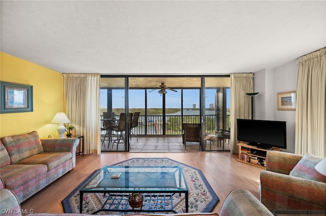 living room featuring hardwood / wood-style flooring and floor to ceiling windows