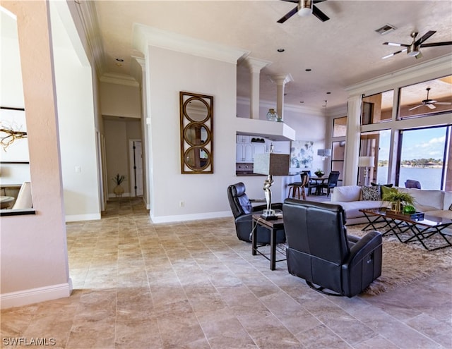 living room featuring ceiling fan and ornamental molding