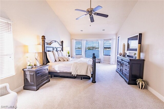 bedroom featuring high vaulted ceiling, ceiling fan, and carpet floors