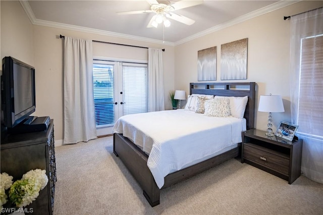 carpeted bedroom with ceiling fan and ornamental molding