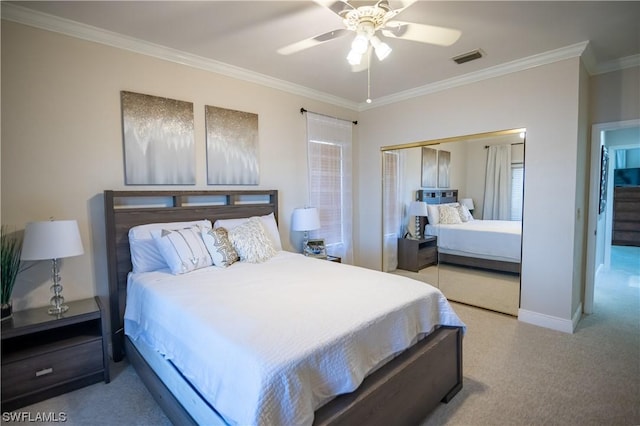 bedroom featuring multiple windows, a closet, ceiling fan, and crown molding