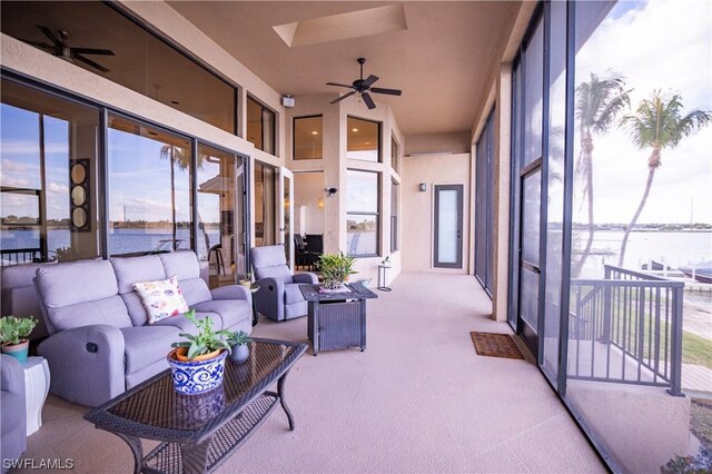 sunroom / solarium with a skylight and ceiling fan