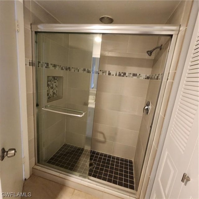 bathroom featuring a shower stall