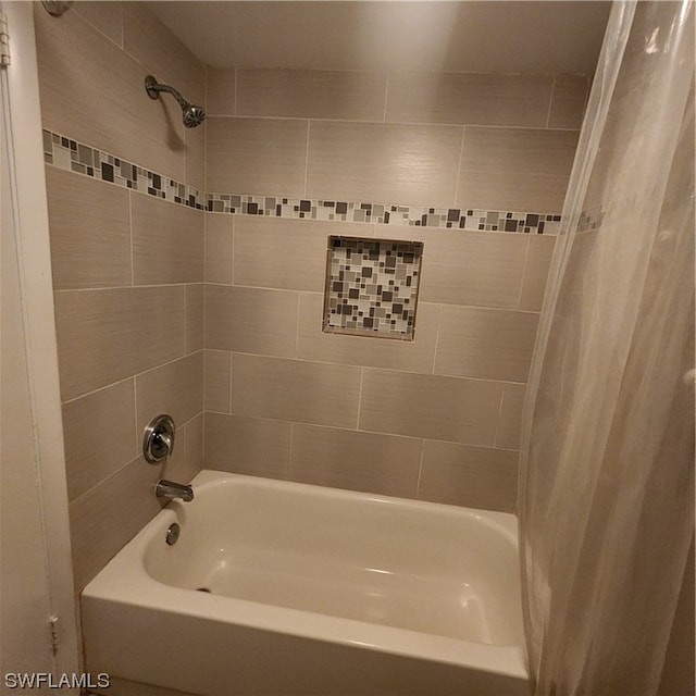 bathroom featuring shower / bath combo with shower curtain