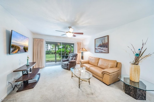 living room featuring carpet floors and ceiling fan