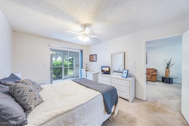 carpeted bedroom featuring a textured ceiling, ceiling fan, and access to exterior