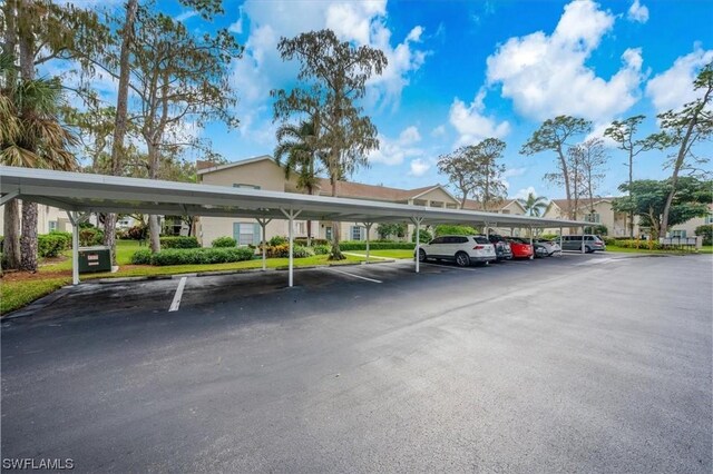 view of vehicle parking with a carport