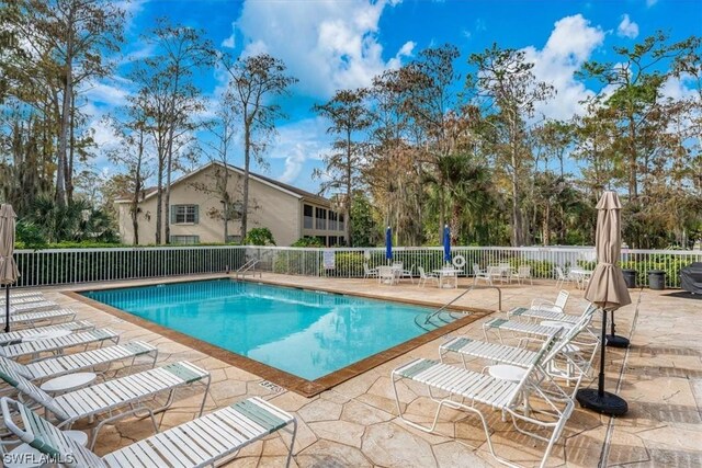 view of swimming pool with a patio area