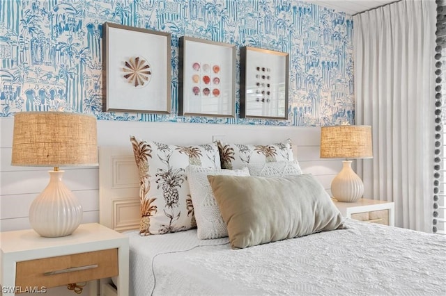 bedroom featuring wallpapered walls