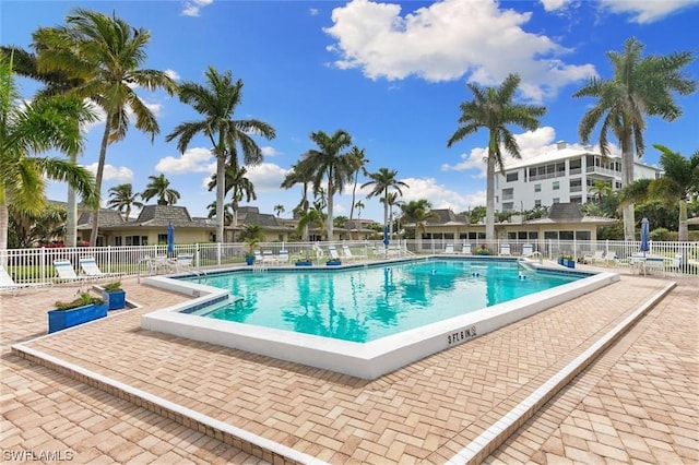 pool featuring a patio and fence