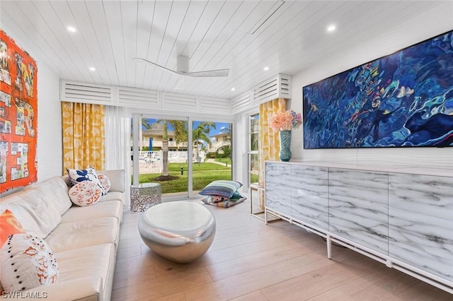 living room with recessed lighting, wood ceiling, and wood finished floors