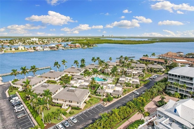 birds eye view of property featuring a water view and a residential view