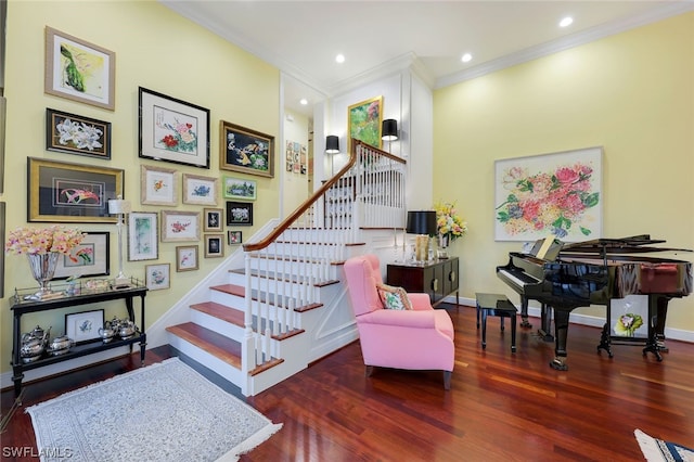 stairs with crown molding and hardwood / wood-style floors