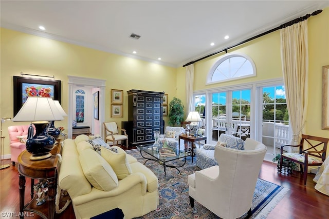 living room featuring dark hardwood / wood-style flooring, crown molding, a high ceiling, and french doors