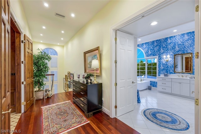 interior space with sink and hardwood / wood-style flooring