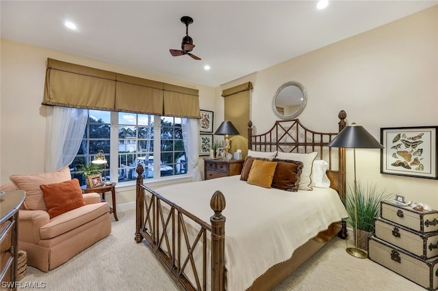 bedroom with ceiling fan and light carpet